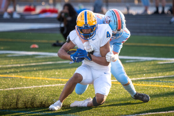 A Ballantyne Ridge player tackles Fort Mill's Josef Anderson just short of the goal line. Anderson would score on the next play.