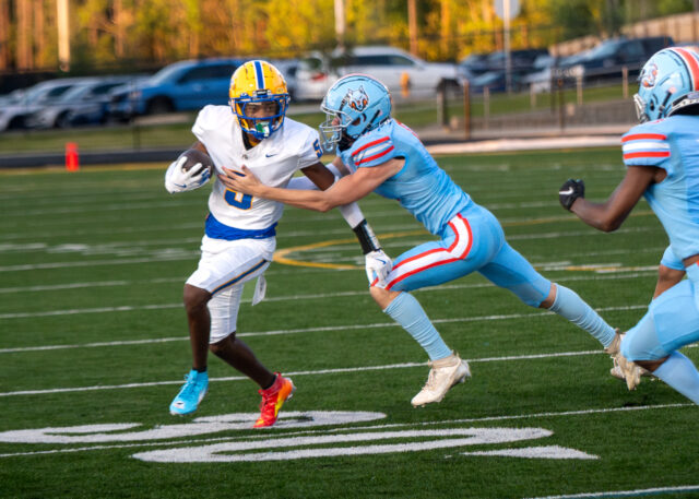 Senior Jeremiah McNeil trys to evade a tackle