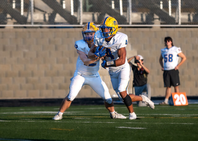 Josef Anderson takes the hand off from Yellow Jacket quaterback, Quinn Kelly.