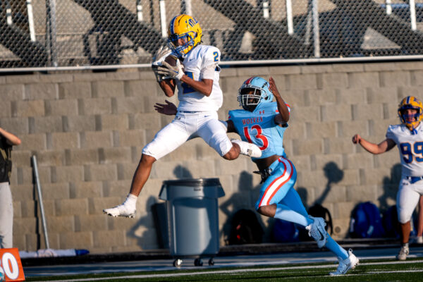 Brandon Moore reels in a throw from Yellow Jacket QB, Quinn Kelly.