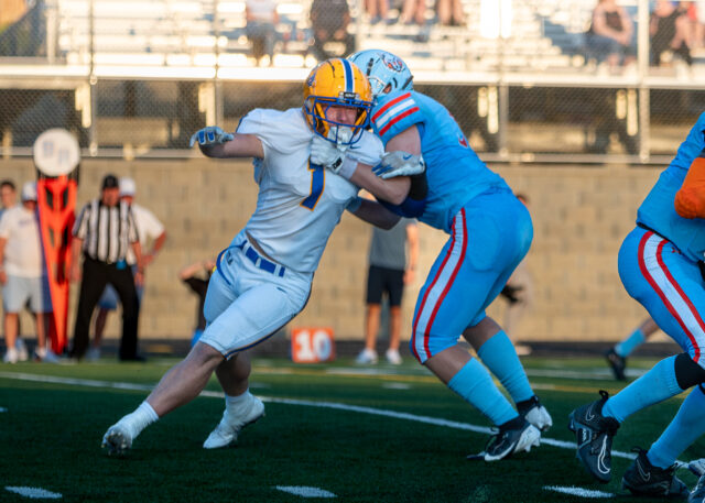 Bo Blankenship is slowed in his hunt for Ballantyne Ridge quaterback.