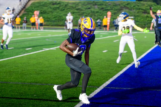 Fort Mill's Deveian Southward scored the Yellow Jacket's first touchdown of the night on a throw from quarterback Quinn Kelly.