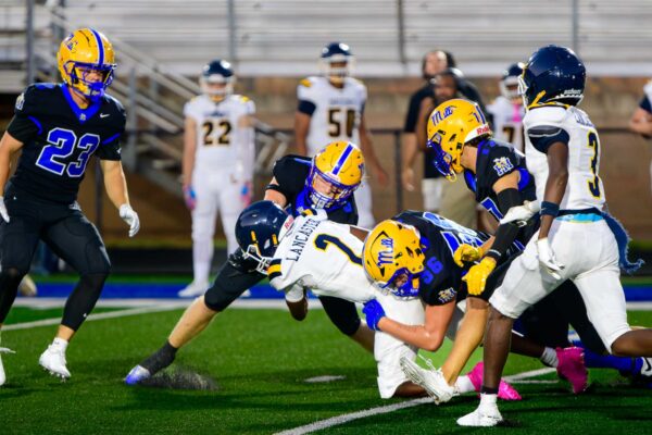 Fort Mill's defense swarmed the Lancaster offense forcing an interception and fumble recovery on the night. The Yellow Jacket's Smith Stapleton makes a key stop against Lancaster's Jamarrion Patton early in the first quarter.